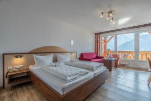 Llit o llits en una habitació de Hotel-Gasthof Andreas