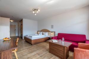 Llit o llits en una habitació de Hotel-Gasthof Andreas