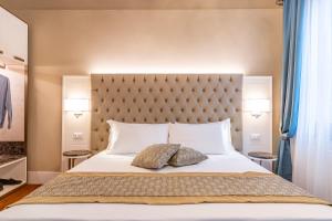 Posteľ alebo postele v izbe v ubytovaní Residenza La Duchessa Deluxe Rooms