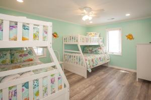 a room with two bunk beds and a ceiling at Lazy Day-Z in Virginia Beach