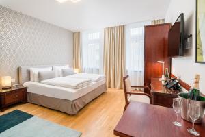 Posteľ alebo postele v izbe v ubytovaní Best Western Plus Celebrity Suites