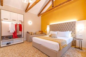 Posteľ alebo postele v izbe v ubytovaní Residenza La Duchessa Deluxe Rooms