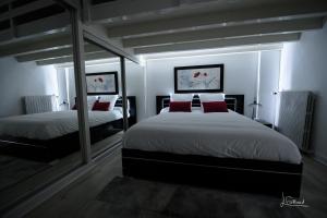 מיטה או מיטות בחדר ב-Le Happy - Épinal centre