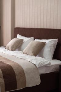 Ένα ή περισσότερα κρεβάτια σε δωμάτιο στο RentWill apartments Panoramic View