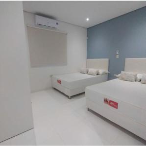 Postel nebo postele na pokoji v ubytování Villa San Nicolás con piscina
