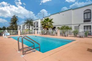 a swimming pool in front of a building at Sleep Inn Destin near Miramar Beach in Destin