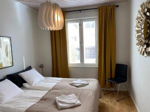 a bedroom with two beds and a window at Stava Mosters in Mariehamn