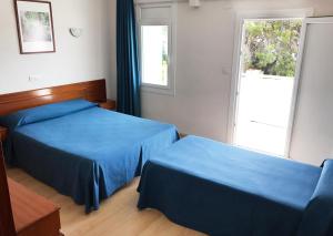 Postel nebo postele na pokoji v ubytování Hotel Roca