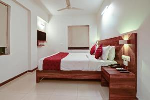 Tempat tidur dalam kamar di SRTC Hotel Aspire