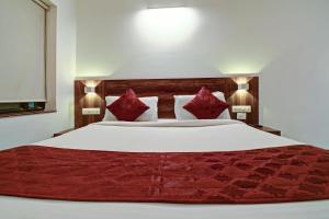 Tempat tidur dalam kamar di SRTC Hotel Aspire