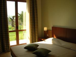 Letto o letti in una camera di Hermes Hotel