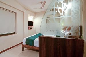 Tempat tidur dalam kamar di SRTC Hotel Aspire