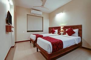 Tempat tidur dalam kamar di SRTC Hotel Aspire