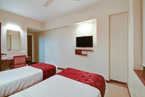 Tempat tidur dalam kamar di SRTC Hotel Aspire