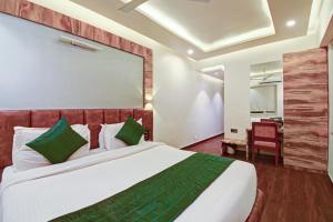 Tempat tidur dalam kamar di SRTC Hotel Aspire