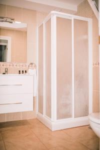 a bathroom with a shower and a sink at Casa Naihu in La Listada