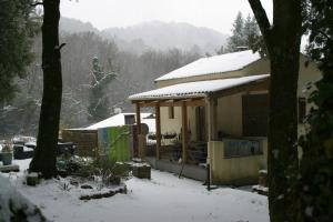 a house with snow on top of it at a casetta di a Faragina in Zonza