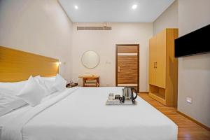 Postel nebo postele na pokoji v ubytování UPAR Hotels - T Nagar