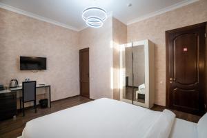 Postel nebo postele na pokoji v ubytování Siberia Hotel