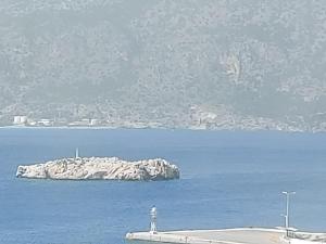 a small island in the middle of a body of water at Amaryllis Hotel in Karpathos