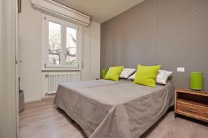 A bed or beds in a room at Villa Paier Relais & Pool