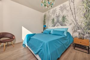 A bed or beds in a room at Villa Paier Relais & Pool