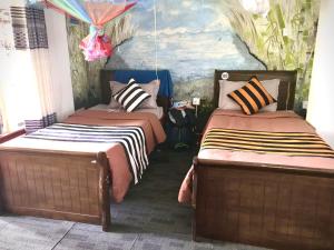 Katil atau katil-katil dalam bilik di Noname Hostel And Cafe