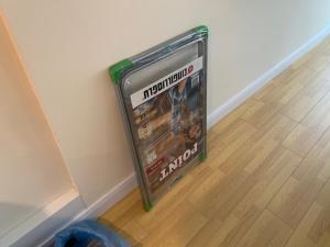 a dvd leaning against the corner of a wall at Luxury Studio with Ocean View in Batumi
