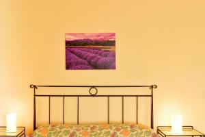 A bed or beds in a room at Agriturismo IL BORGHETTO