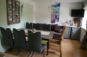 a dining room with a table and chairs at Thalerhof in Roppen