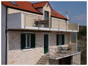 an external view of a house with a balcony at House Natalija in Podgreben