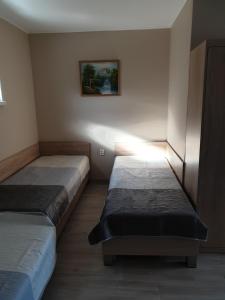 Postel nebo postele na pokoji v ubytování Minerál