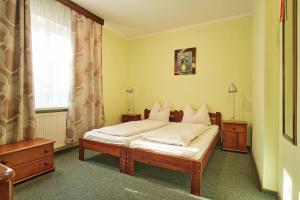 Postel nebo postele na pokoji v ubytování Willa Preludium