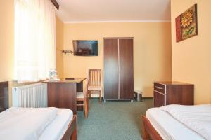 Postel nebo postele na pokoji v ubytování Willa Preludium