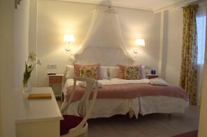 Łóżko lub łóżka w pokoju w obiekcie Ares Hotel