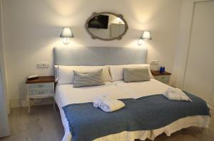 Łóżko lub łóżka w pokoju w obiekcie Ares Hotel