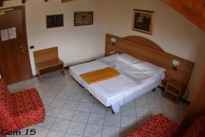 מיטה או מיטות בחדר ב-Hotel Fiorentino