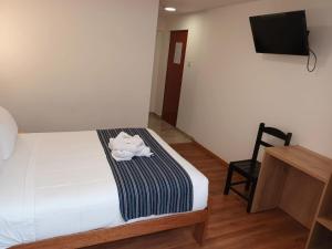 Postel nebo postele na pokoji v ubytování Cusco Hostal Qolla Wasi-II