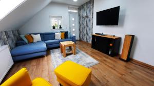 A television and/or entertainment centre at AllOne apartman