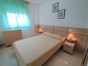 Postel nebo postele na pokoji v ubytování ACV - Costa Azahar II-2ª linea, planta 6, sur