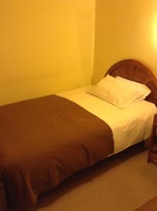 Postel nebo postele na pokoji v ubytování Royal Inn Hotel Juliaca