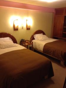 Postel nebo postele na pokoji v ubytování Royal Inn Hotel Juliaca