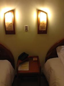 Postel nebo postele na pokoji v ubytování Royal Inn Hotel Juliaca