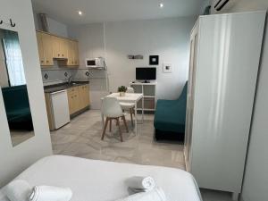 Kuchyň nebo kuchyňský kout v ubytování Apartamentos Ortega
