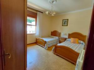 Postel nebo postele na pokoji v ubytování Casa Cabaleiro