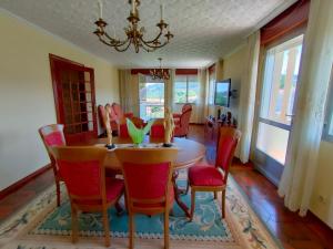 a dining room with a table and chairs at Casa Cabaleiro in Seixo