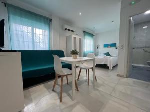 Postel nebo postele na pokoji v ubytování Apartamentos Ortega