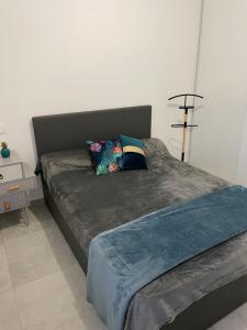 Postel nebo postele na pokoji v ubytování Villa Renzo