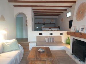 a living room with a couch and a fireplace at Casa Alcasar in Benitachell