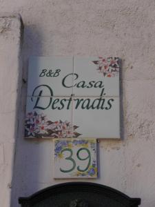 a sign for a casa de españoles on a wall at Casa Destradis B&B in Oria